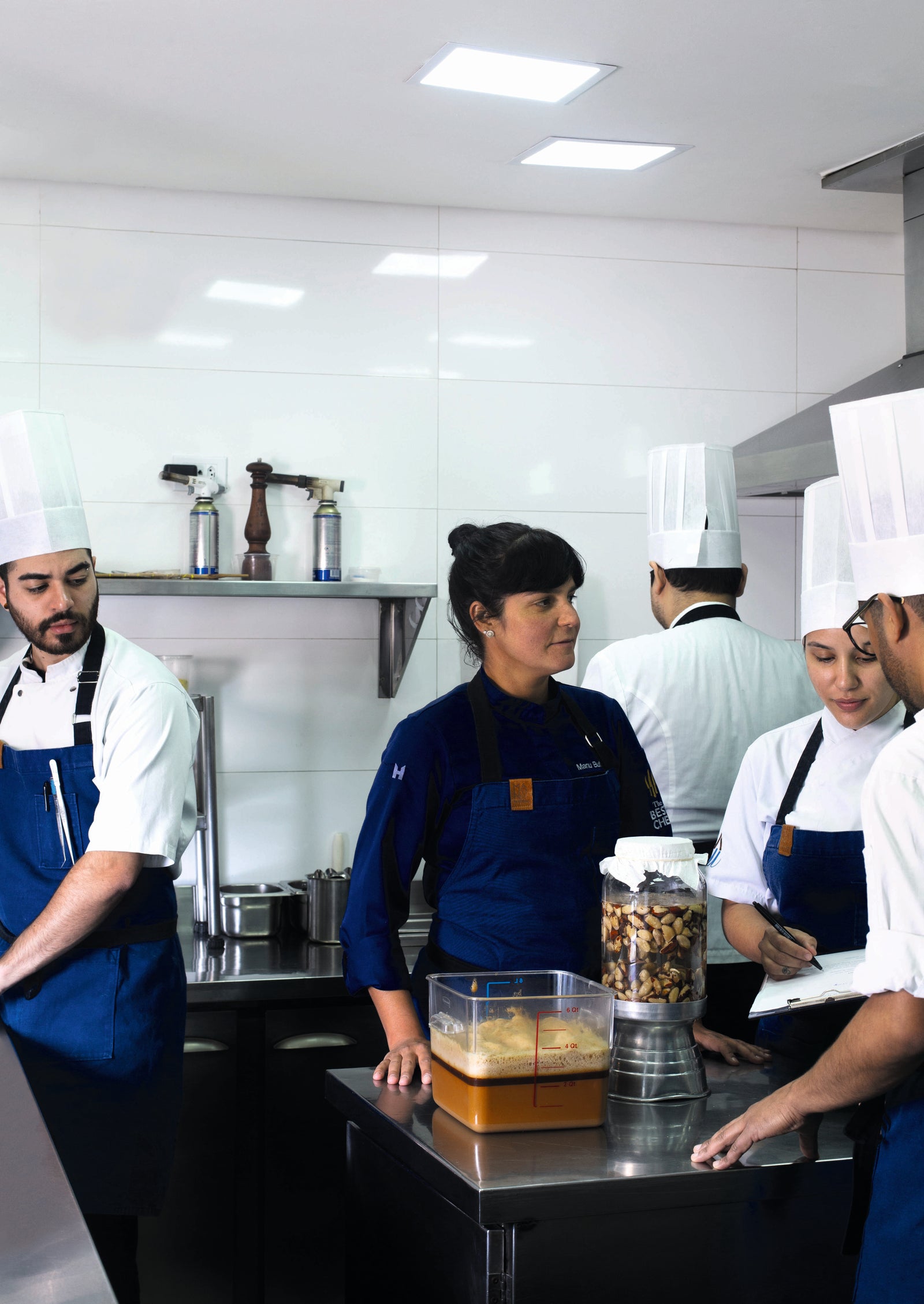 Manoella ‘Manu’ Buffara and team members preparing for dinner service. Photography by Helena Peixoto