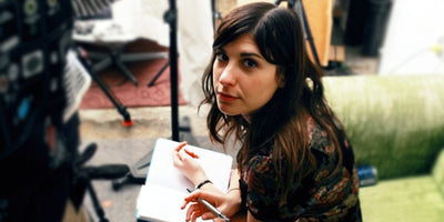 tech museum movers carrying large exhibit piece inside modern museum space