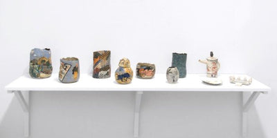 ceramics recent renaissance art pottery display with various ceramic pieces on shelves