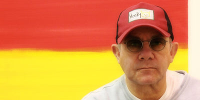 Bernie Taupin interview portrait with microphone on stage