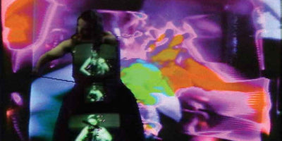 Close-up of Nam June Paik artwork with vibrant colors and abstract shapes on a 900x450 canvas