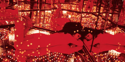 art book installation with open books displayed on a table in a gallery setting