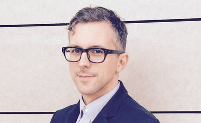 Andrew Edlin Gallery director Phillip March Jones discussing outsider art at an art event