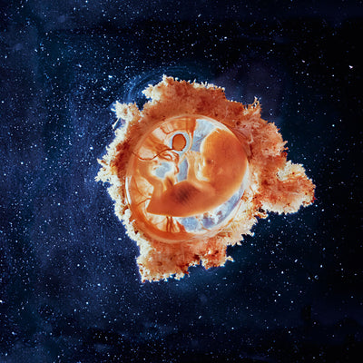 spaceman in a white spacesuit floating in space against a dark starry background