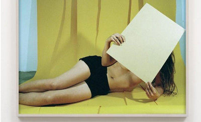 Whitney Hubbs in the studio thinking creatively during a photoshoot session