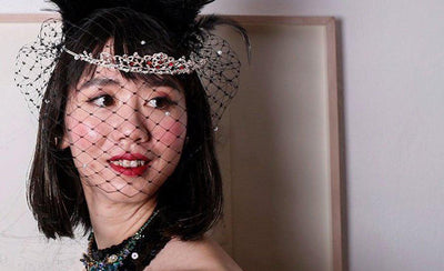 charity auction interview story banner with people and auction items in background