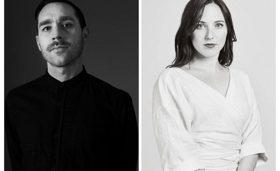 assembly line workers collaborating in a factory setting with machinery and tools