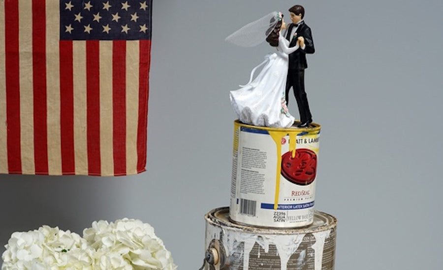 Ross Craig photographer holding camera taking picture outdoors