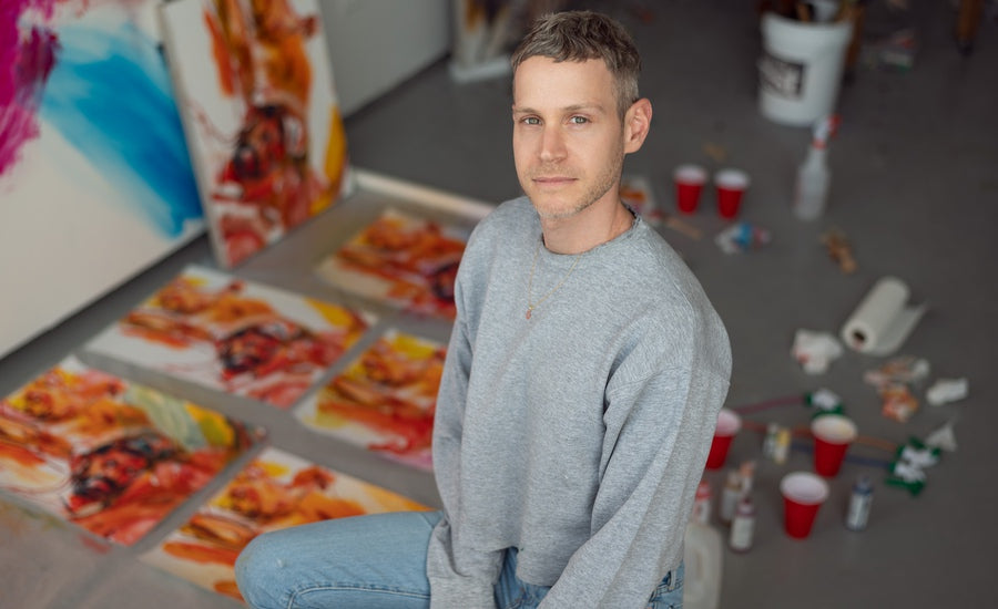 Doron Langberg artist portrait with artwork background inspired by love new edition exhibition