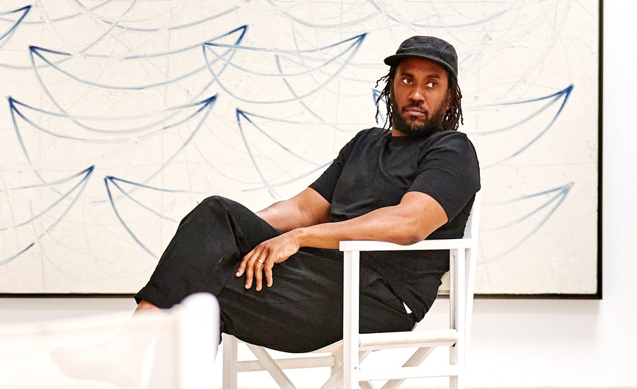 Rashid Johnson artist portrait with abstract artwork background