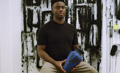 Hand-painted ceramic amphora by Adam Pendleton for Charity Water campaign