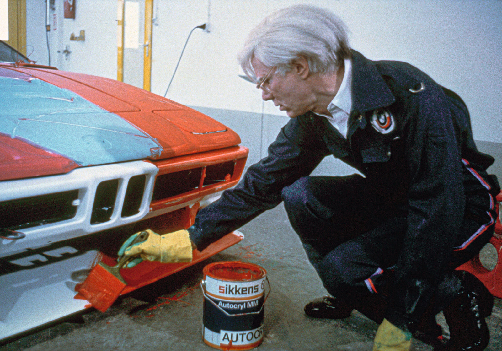 Andy Warhol painting BMW M1, Hebertshausen, May 17, 1979. Colour photograph. Photo by Jean-Marie Bottequin, courtesy BMW Group Classic