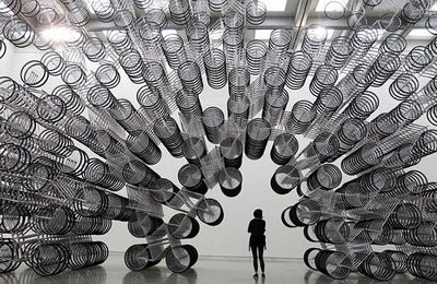 Weiwei Forever Bicycles art installation featuring numerous white bicycles arranged in a circular pattern