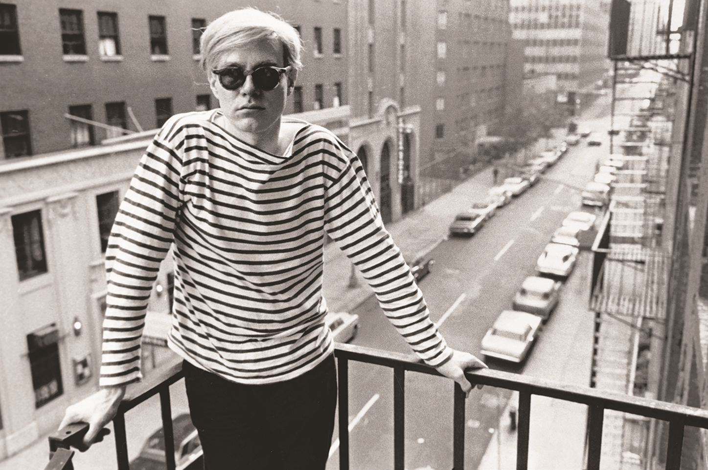Stephen Shore: Andy Warhol on fire escape of the Factory, 231 East 47th Street, 1965-7. As reproduced in Factory: Andy Warhol by Stephen Shore