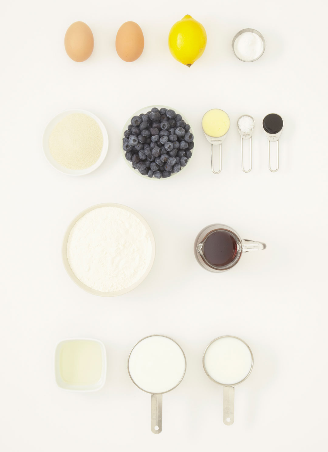 Ingredients for buttermilk pancakes with blueberries and syrup, as featured in Simple & Classic