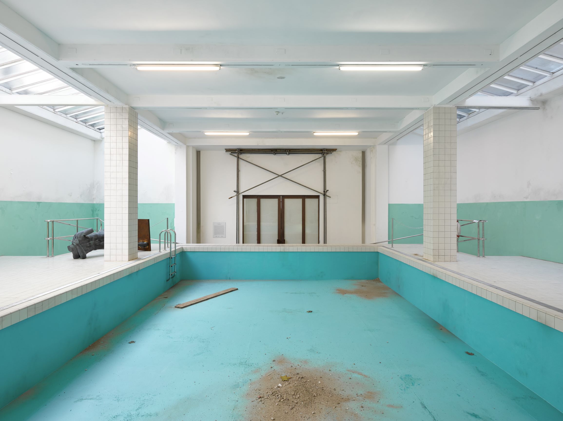 The Whitechapel Pool, 2018; wood, tiles, latex, polished stainless steel, linoleum, paint, 600 x 1450 x 2340 cm, installation view of 'This Is How We Bite Our Tongue', Whitechapel Gallery, London, 2018. Artwork © Elmgreen & Dragset 