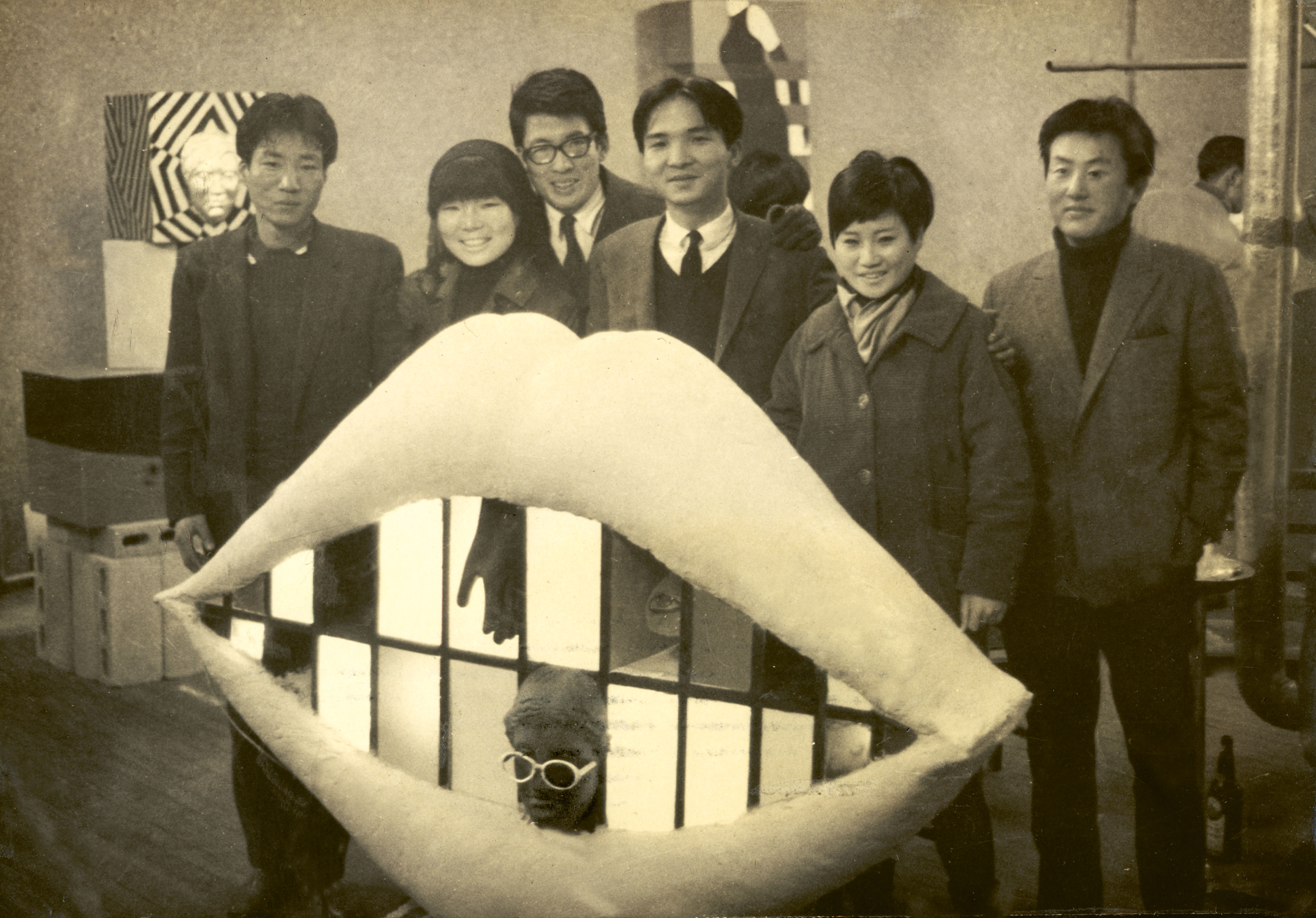 Artists of the Shinjeon Group – Kang Kuk-jin, Jung Kang-ja, Chung Chan-seung, Kim In-hwan, Shim Sun-hee, Yang Duk-soo – standing by Jung’s work Kiss me (1967), at the ‘Union Exhibition of Korean Young Artists’, Korea Information Center, Seoul, 1967