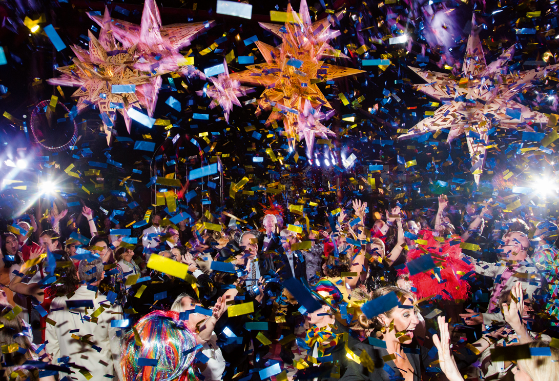 Confetti and guests explode on a dancefloor