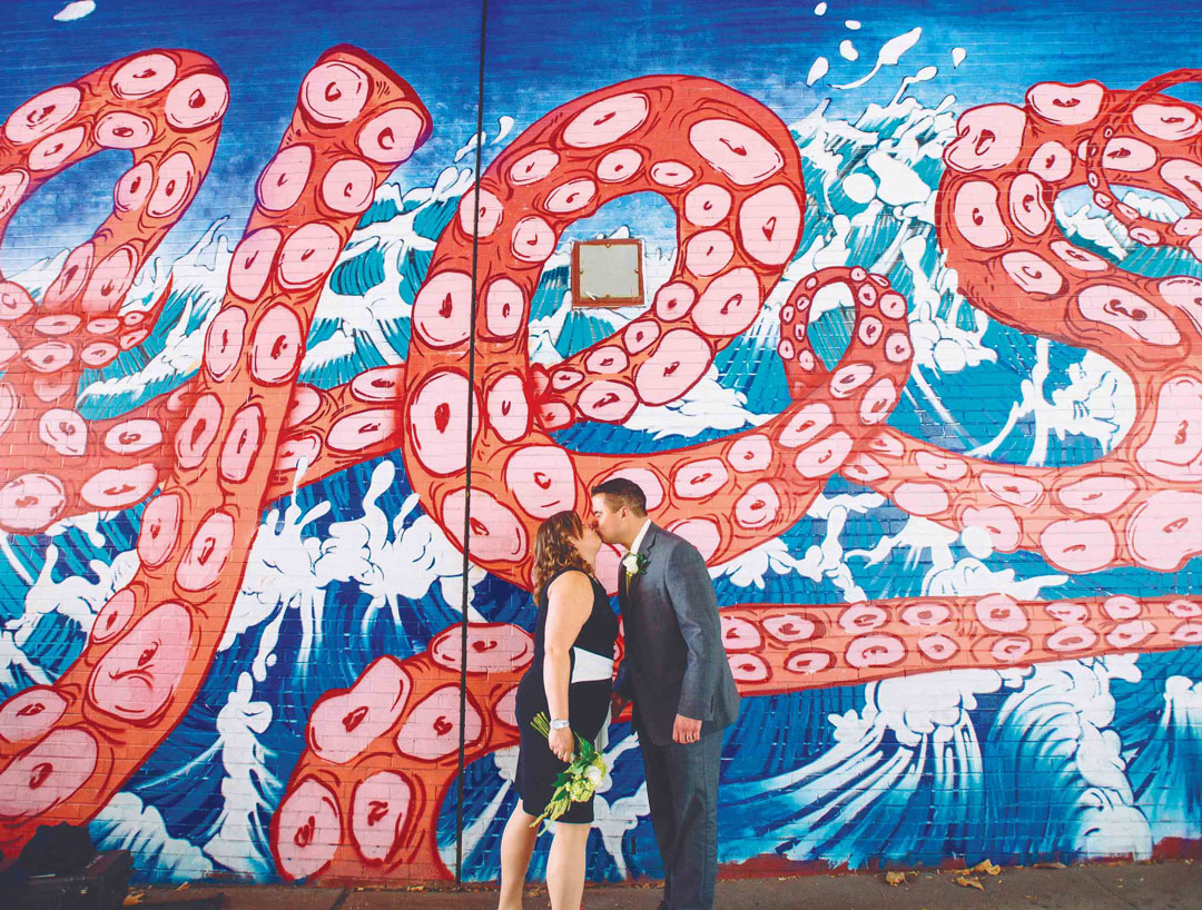 A neglected underpass below the Brooklyn-Queens Expressway, since decorated by Sagmeister & Walsh with the word YES on either side, being used by newlyweds as a backdrop for wedding photos. Picture credit: © Pop! Wed Co.