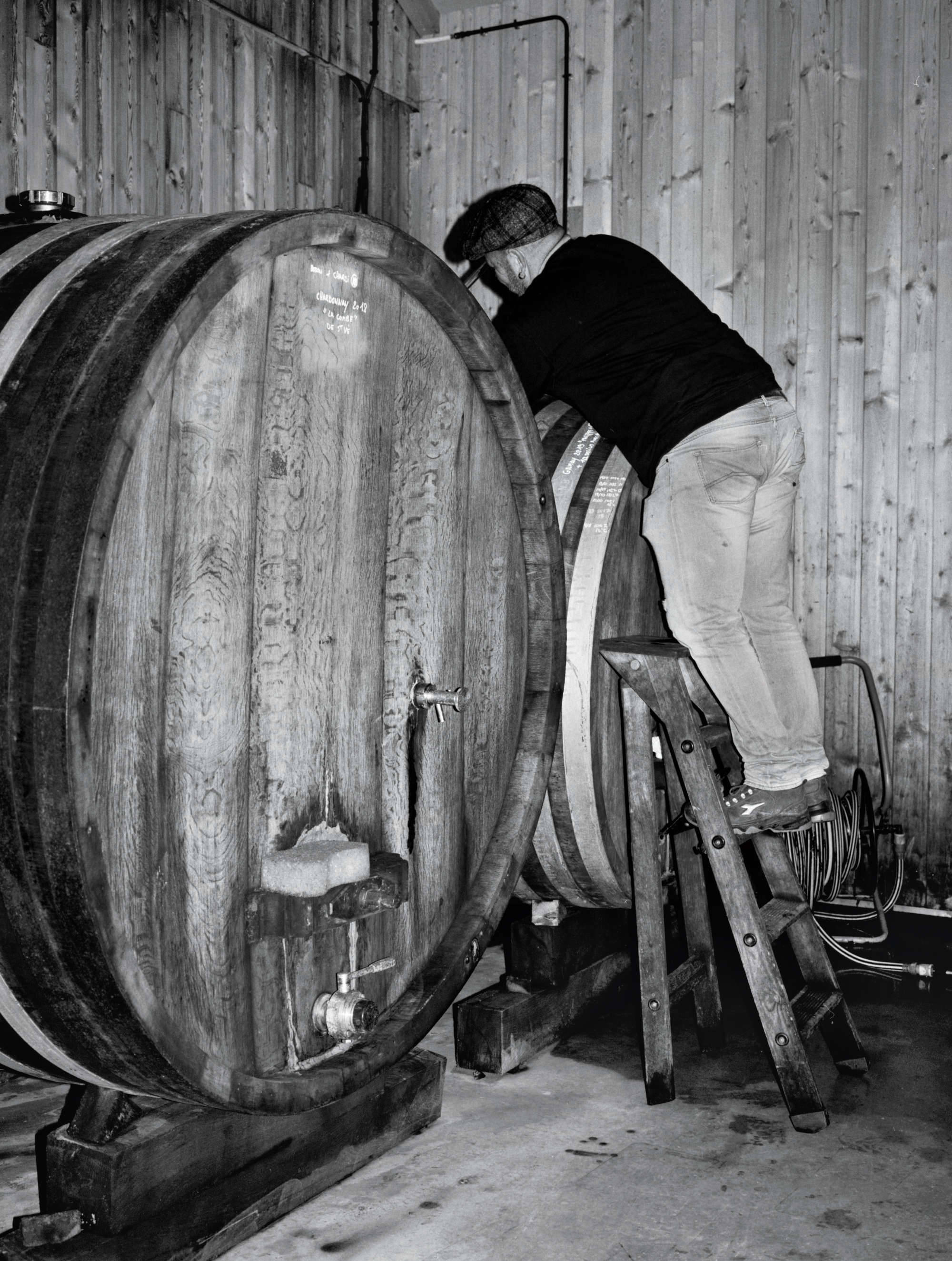 Jura winemaker Jean-François ‘Fanfan’ Ganevat drawing off some wine from a barrel. Photographs by Alexandre Guirkinger 