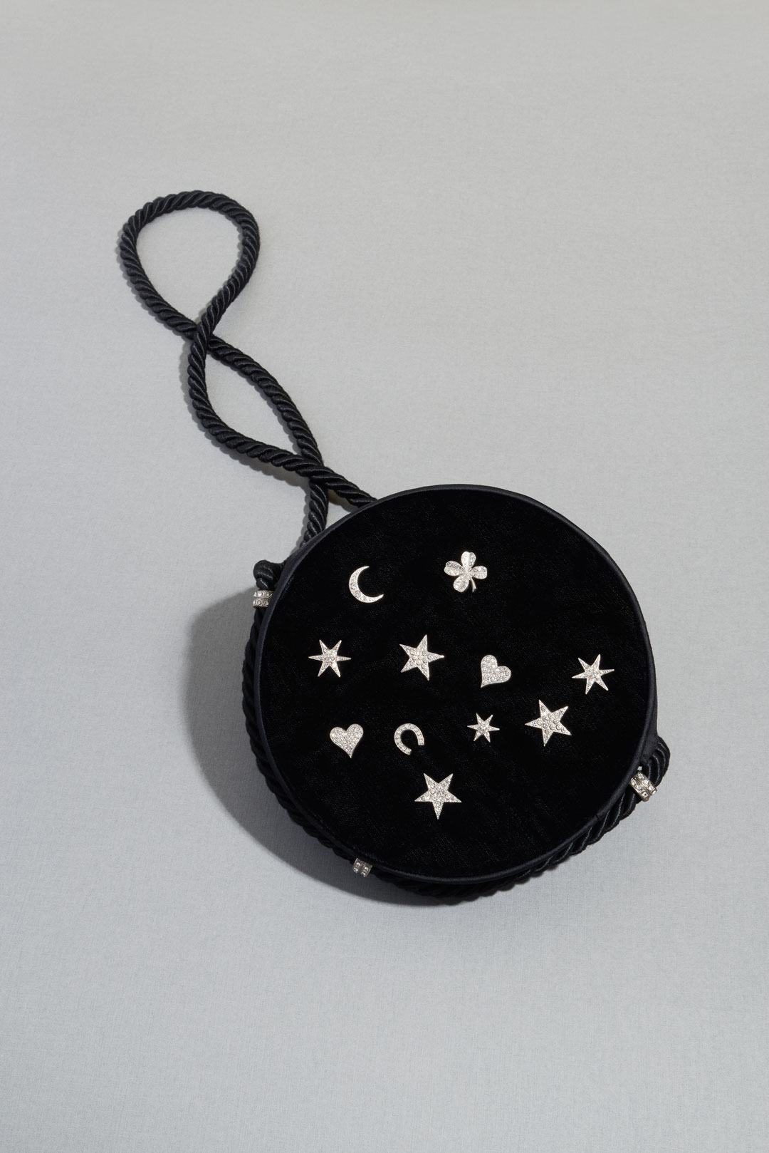 Black velvet tambourine bag with diamanté charms and a black cord strap (made by Renaud), about 1970. Photo by Lavanchy Matthieu
