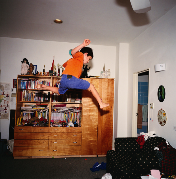 Joe flying across his room, NYC, 1994, by Nan Goldin, from Eden and After