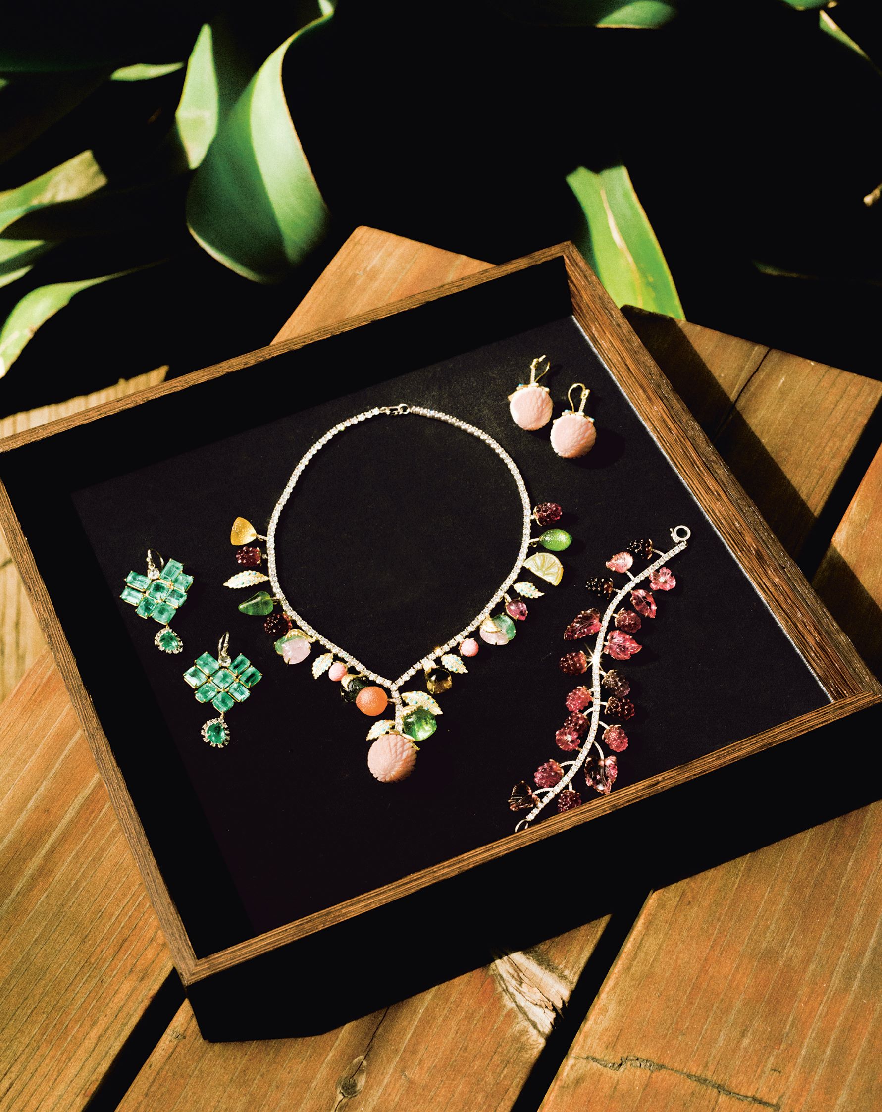Irene Neuwirth's Green Emerald Diamond Gold Double Drop Earrings with One of a Kind Fruit Punch Diamond Necklace, Carved Opal Strawberry Earrings, and One of a Kind Pink Tourmaline and Diamond Raspberry bracelet. Photo by Chantal Anderson