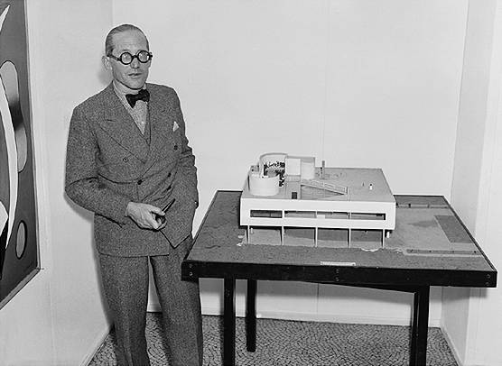 Le Corbusier with his model for Villa Savoye, 1928