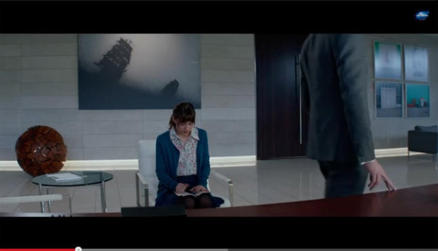 A screengrab from the new 50 Shades of Grey trailer, which appears to feature an Ed Ruscha painting in the background