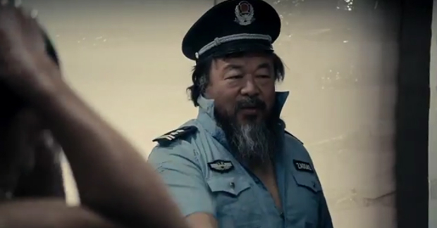 Ai Weiwei posing as a prison guard in his music video Dumbass, 2013