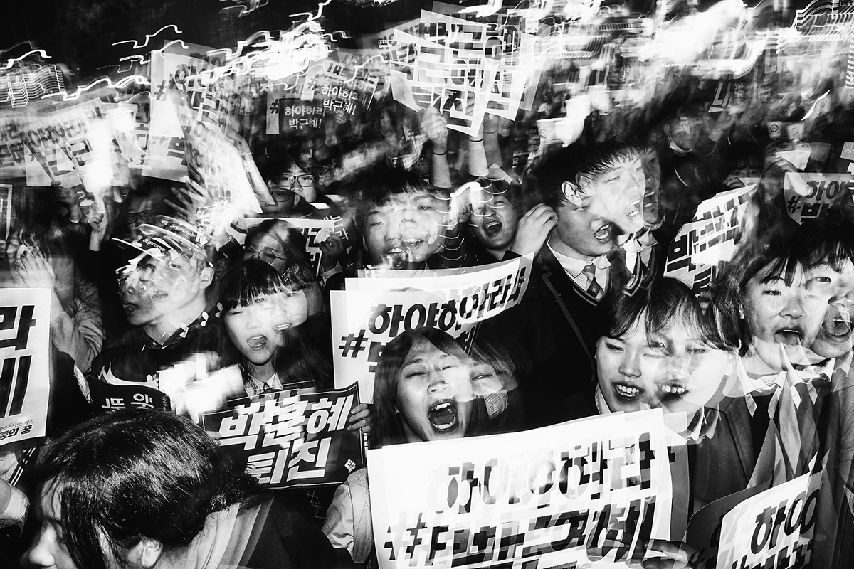 Student Protesters March. Among the most vocal and energetic groups taking part in the anti-president demonstrations are young South Korean students. © Argus Paul Estabrook.Street Series Winner, Magnum and LensCulture Photography Awards 2017