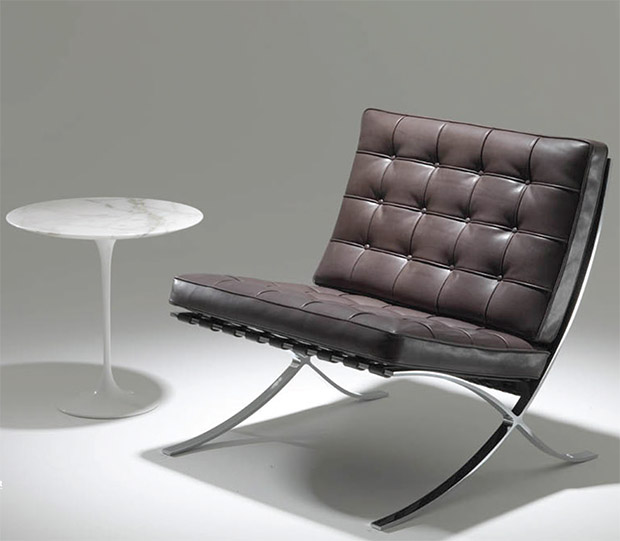 Knoll's new Relax edition of the Barcelona Chair, next to one of Eero Saarinen's tables