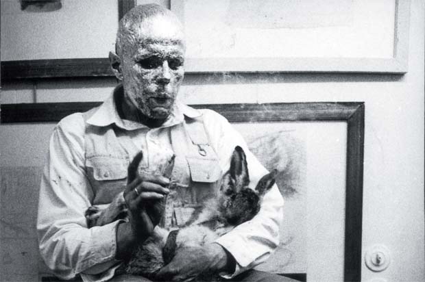 Beuys during his Action How to Explain Pictures to a Dead Hare (Wie man dem toten Hasen die Bilder erklärt), Schelma Gallery, Dusseldorf, 26 November 1965