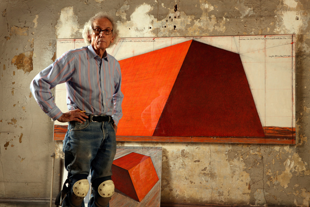 Christo with his Mastaba plans. Photograph by Wolfgang Volz. Image courtesy of the Serpentine
