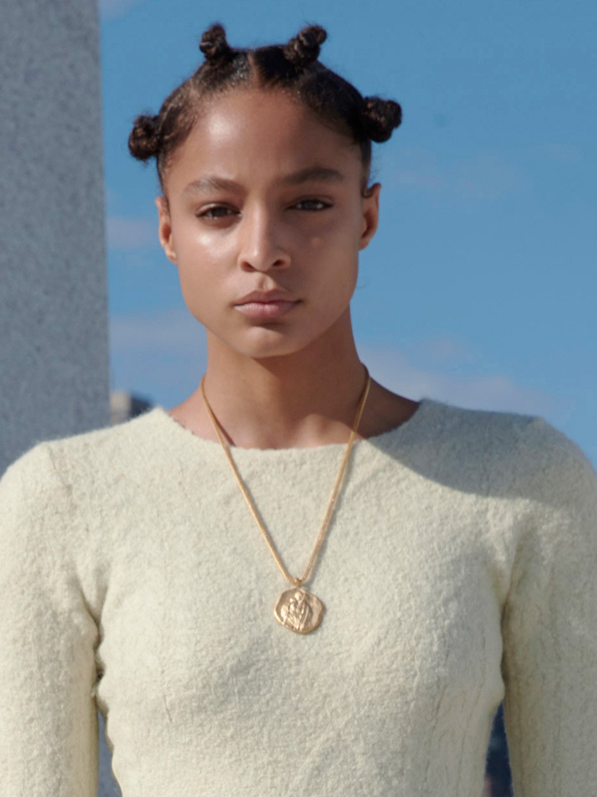A model wears one of the Renaissance-inspired pieces from Kanye West's new Yeezy jewellery collection, at yeezysupply.com