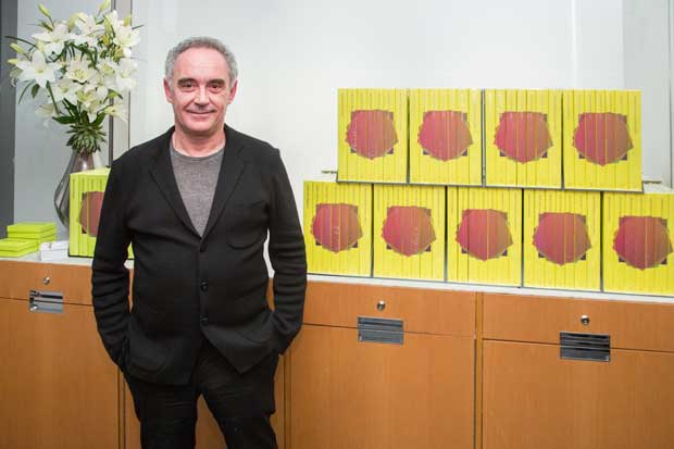 Ferran Adrià poses in front of ElBulli 2005-2011 photo by Scott Rudd