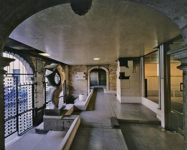 Fondazione Querini Stampalia renovations, Venice, 1961-63, view across water entry room from entrance hall, with the water gates (l) and radiator enclosure and glass wall (r). 
All pictures taken from our Carlo Scarpa book