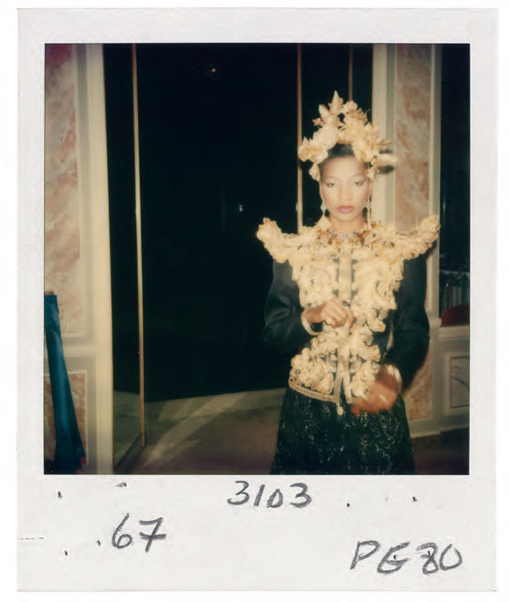 Headdress of gold flowers and leaves created by the designer Nina Wood, worn with a long evening outfit, Spring/Summer 1980 haute couture collection