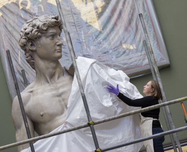Conservator Johanna Puisto unveils the cast of Michelangelo's David post conservation, Nov 2014 in the Weston Cast Court
 