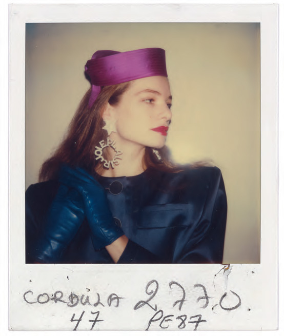 Silk satin pill-box hat, earrings with the words ‘JOIE PLAISIR’ in diamanté (made by Goossens), goatskin gloves, Spring/Summer 1987 haute couture collection © Fondation Pierre Bergé – Yves Saint Laurent, Paris/All Rights Reserved