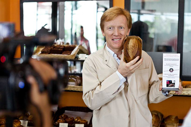 Éric Kayser with his kampot pepper bread at the launch of his Phnom Penh branch