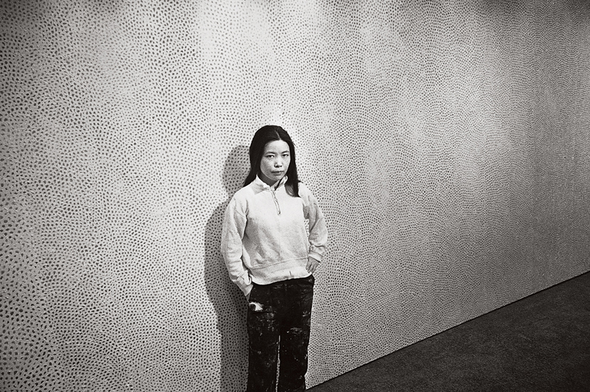 Yayoi Kusama with an Infinity Net painting at the Stephen Radich gallery, New York, 1961