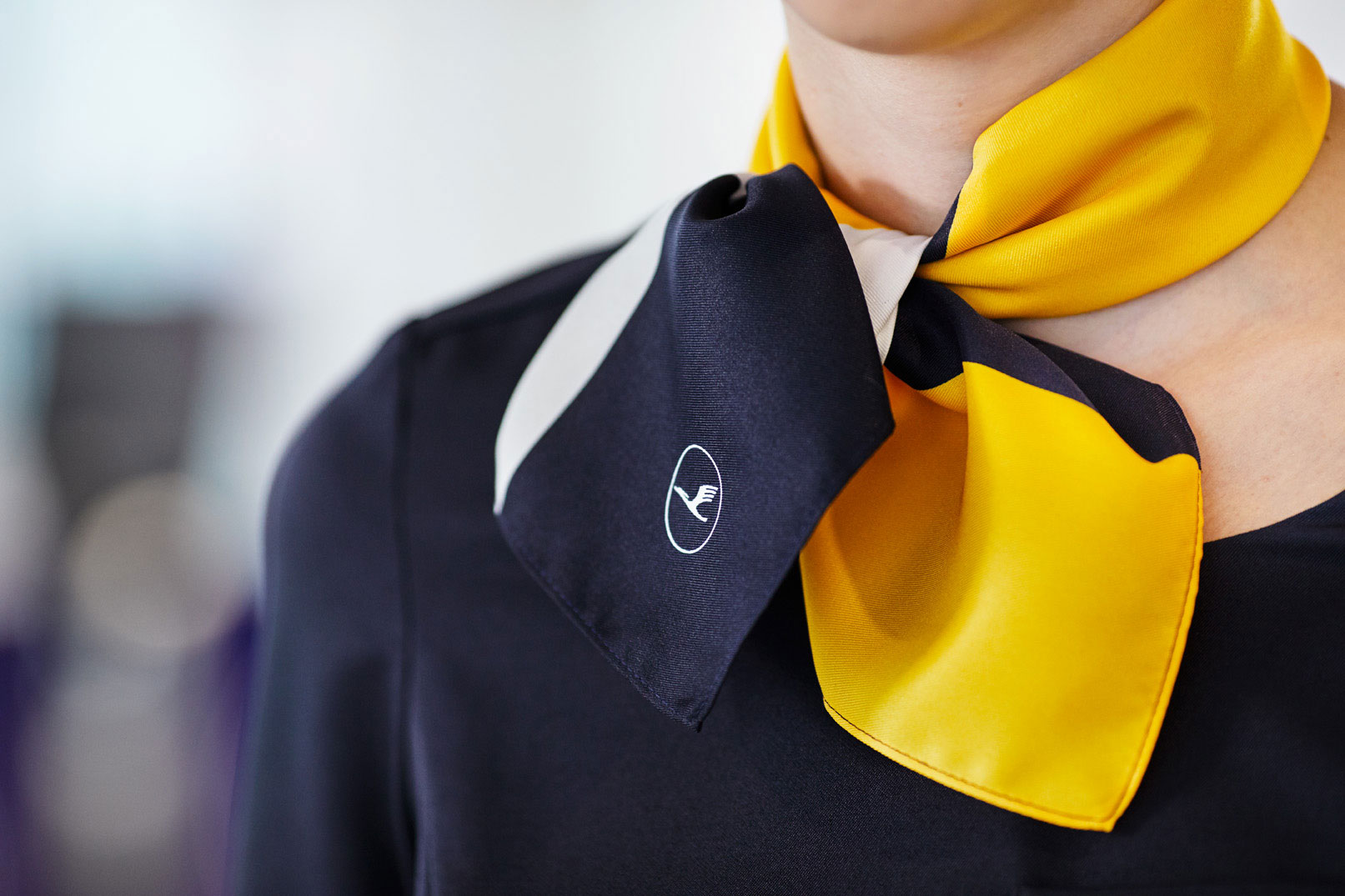 Aicher's yellow will be retained in some instances, such as in the staff uniforms. Image courtesy of Lufthansa