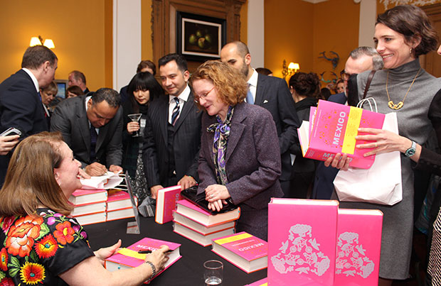 Margarita signs books for the ambassador's guests