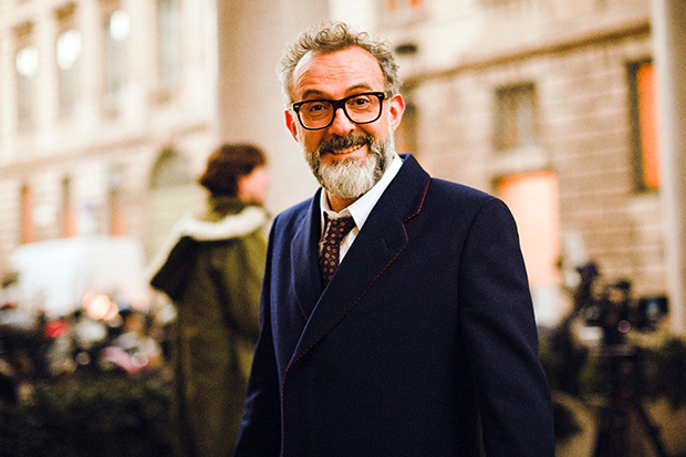 Massimo Bottura in a Gucci navy wool coat with red and blue piping. Image courtesy of British GQ, gq-magazine.co.uk
