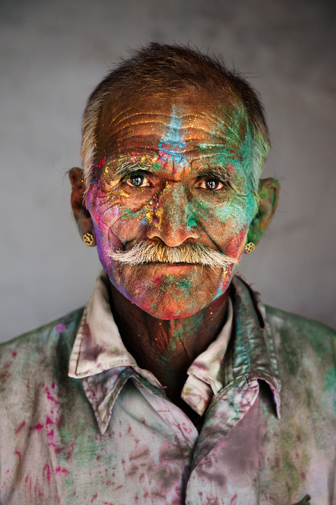 Rajasthan, 2009. Man covered in powder during Holi, the festival of colours. Photograph by Steve McCurry
