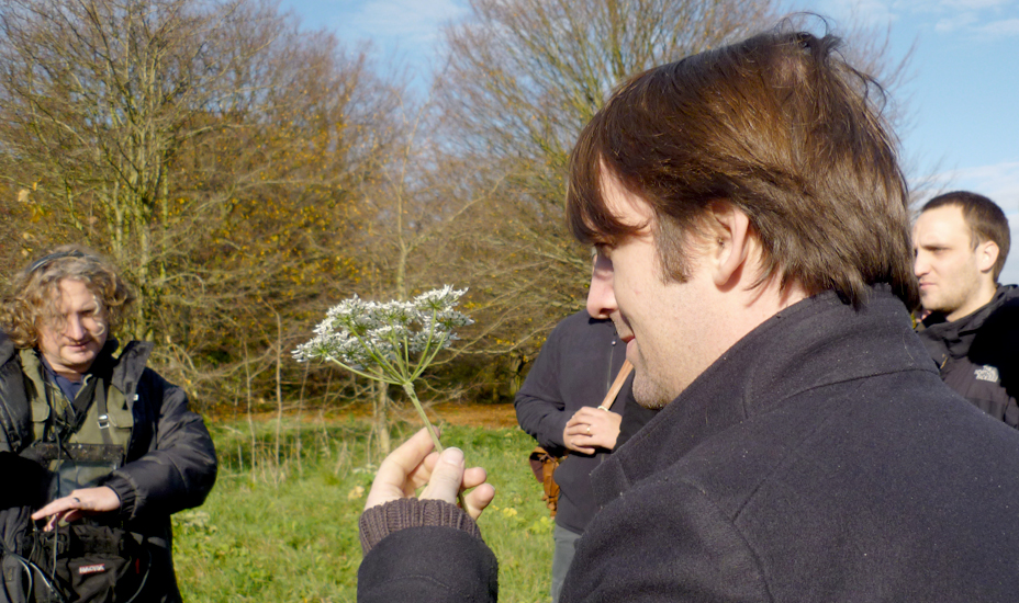 René Redzepi takes a close look at cow parsley on a Cook It Raw weekend while Where Chefs Eat author Joe Warwick (left) looks on