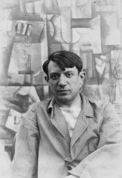 Pablo Picasso, in front of his painting The Aficionado, at Villa les Clochettes, Sorgues, France, summer 1912. This image is in the public domain
