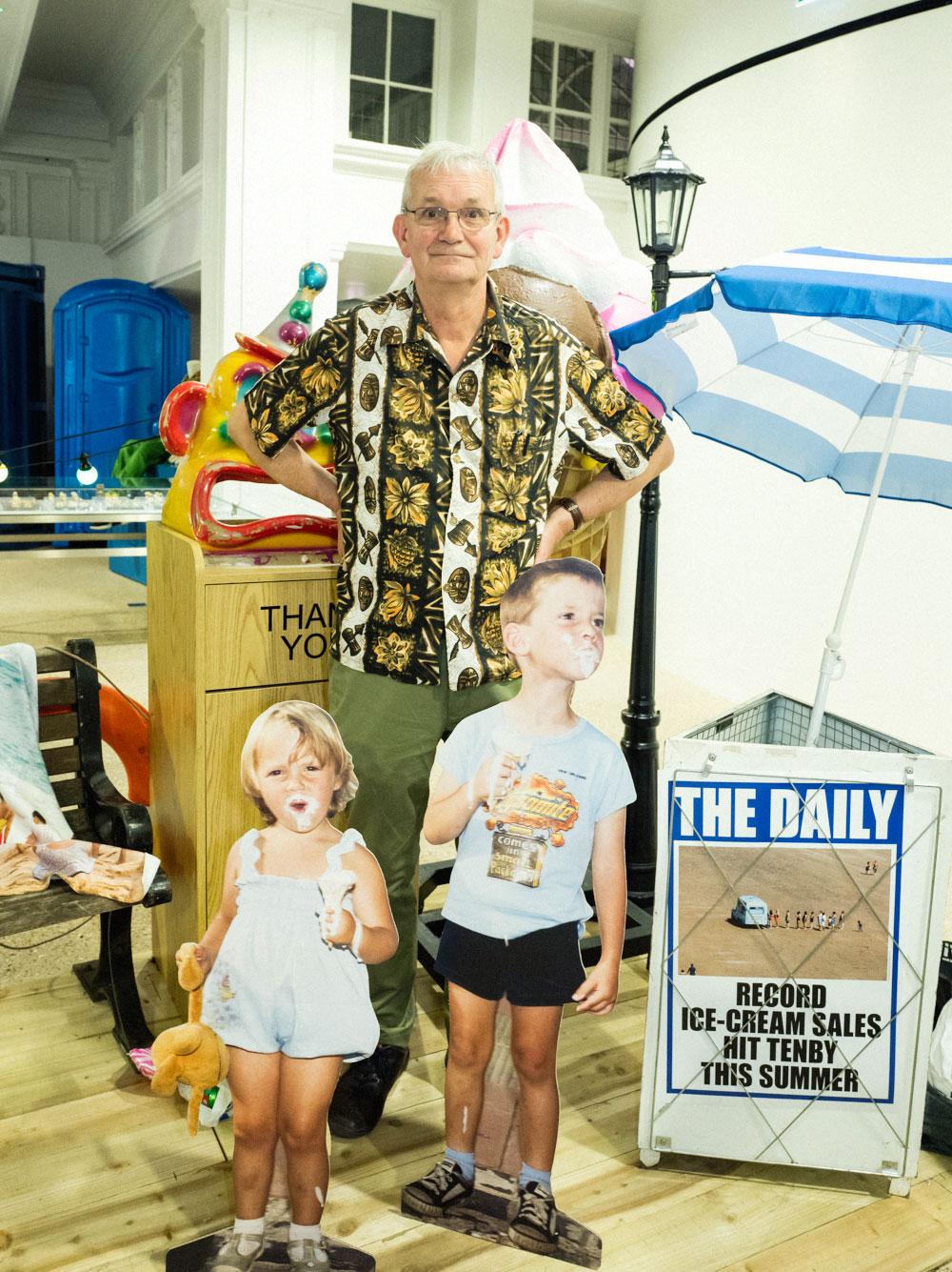Martin Parr with cut-out figures from his 1985 photo story The Last Resort, at Dover Street Market in London