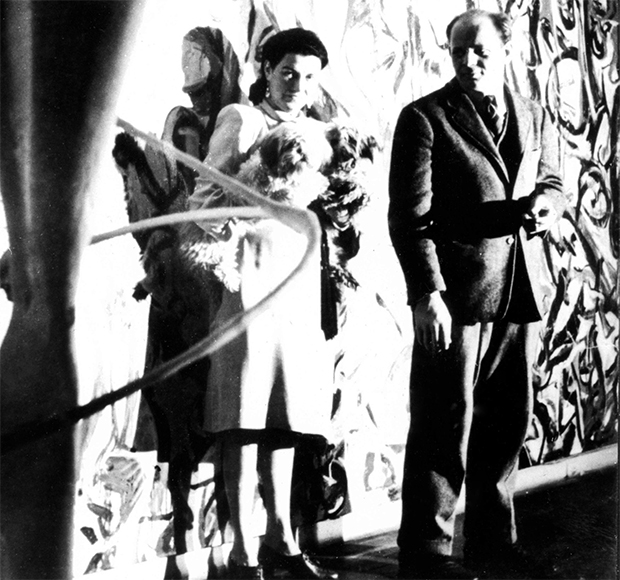 Peggy Guggenheim and Pollock in front of Mural, in the hallway of her town house, c.1944. From our Phaidon Focus book